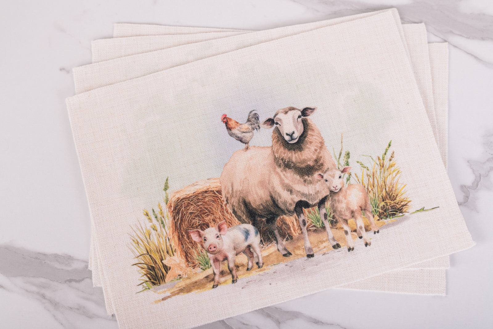Farmhouse placemats set of 4 featuring sheep, lambs, piglet, and rooster watercolor design