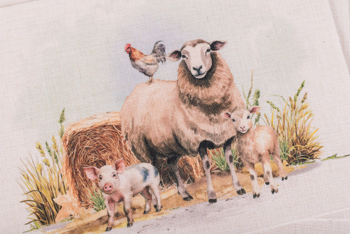 Sheep, lambs, and a chicken in a pastoral setting with hay bale and grass.