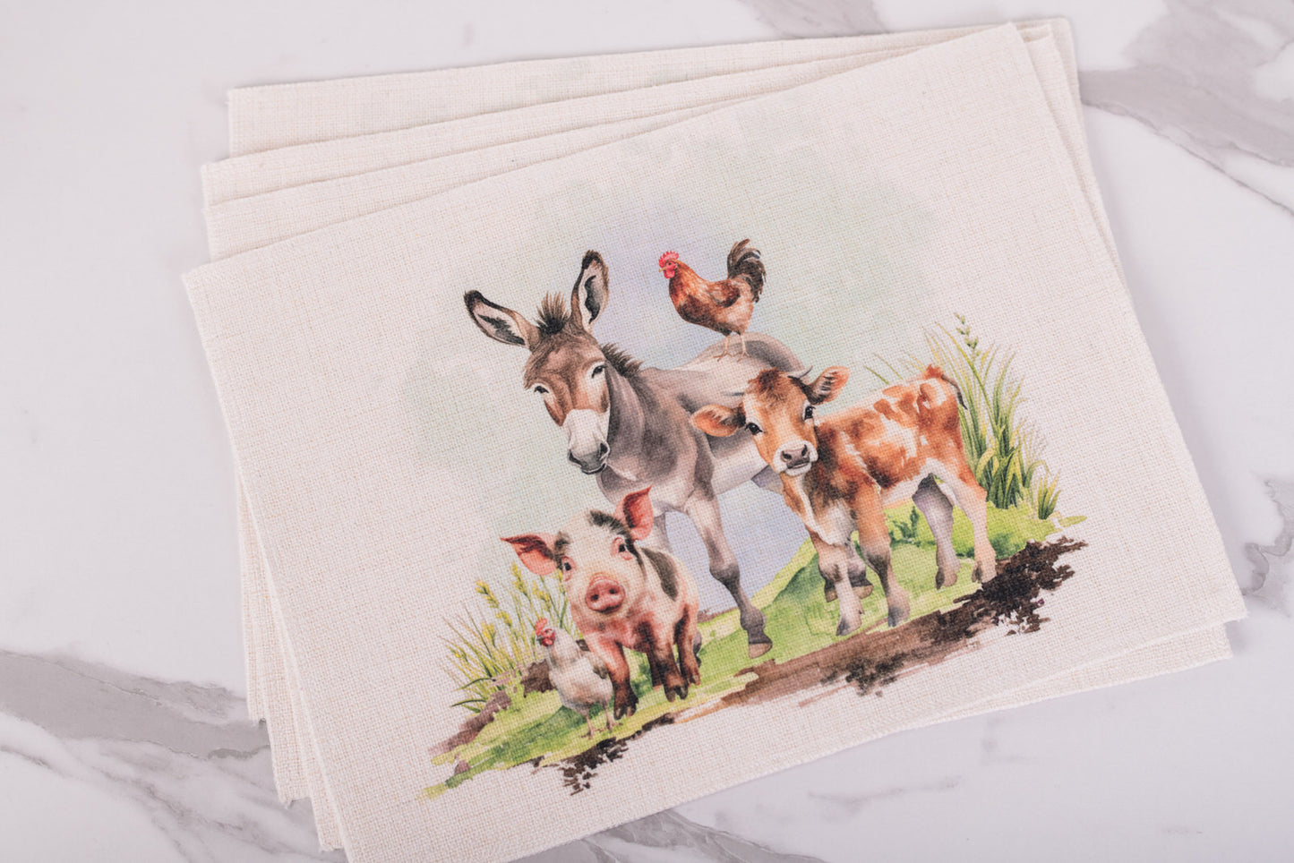 Farm animal placemat design showing donkey, calf, pig, and rooster in soft watercolor style
