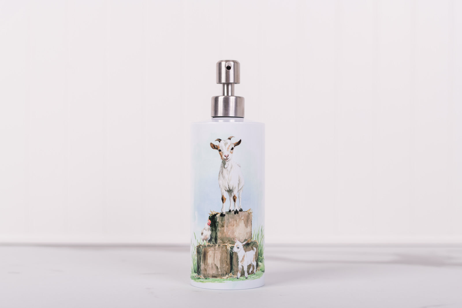 Homestead Collection stainless steel soap dispenser with barnyard goat design