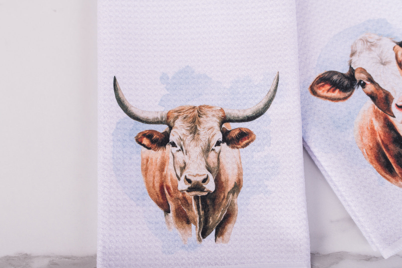 Homestead cow tea towel with longhorn design