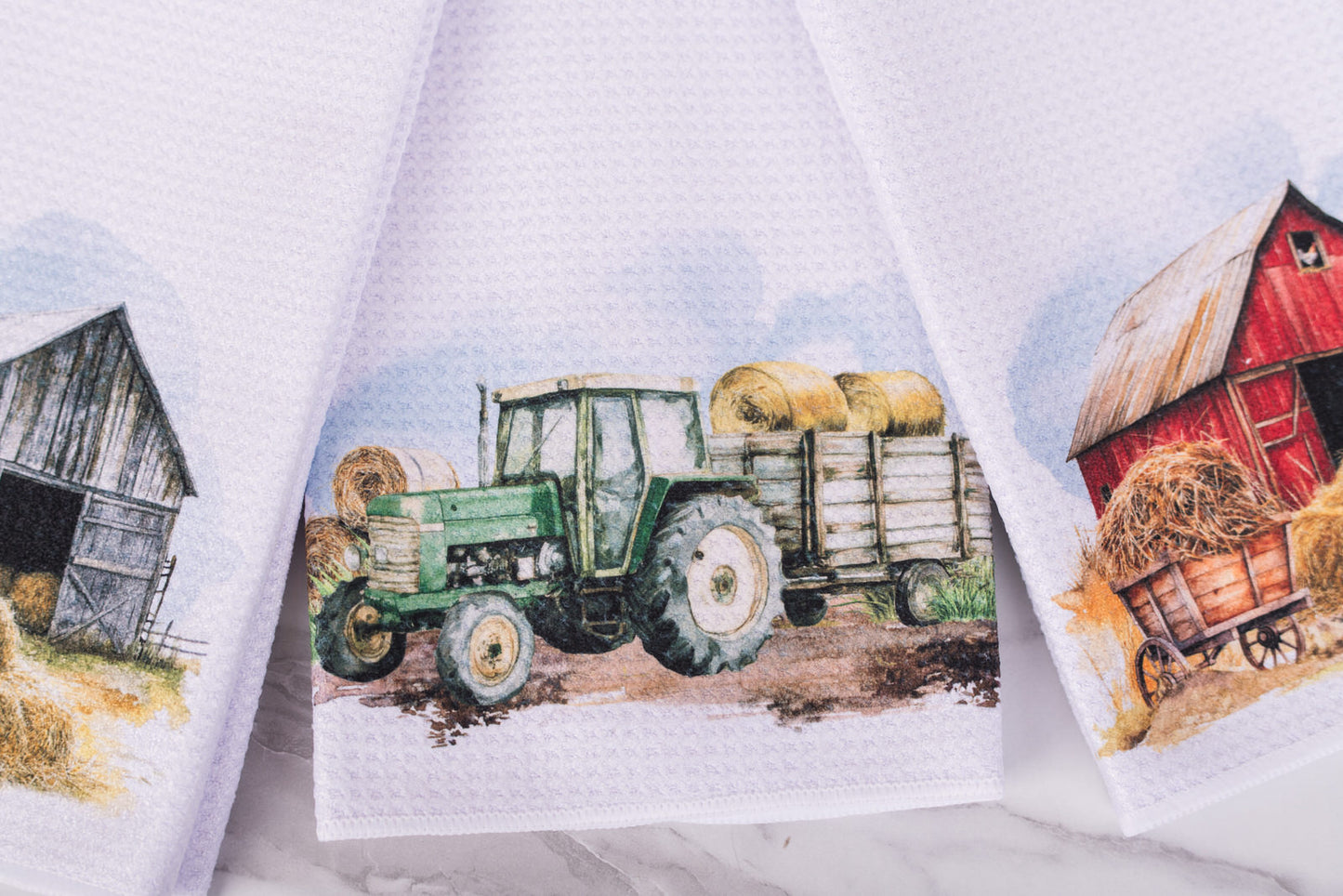Farmhouse kitchen tea towel with green tractor and hay wagon
