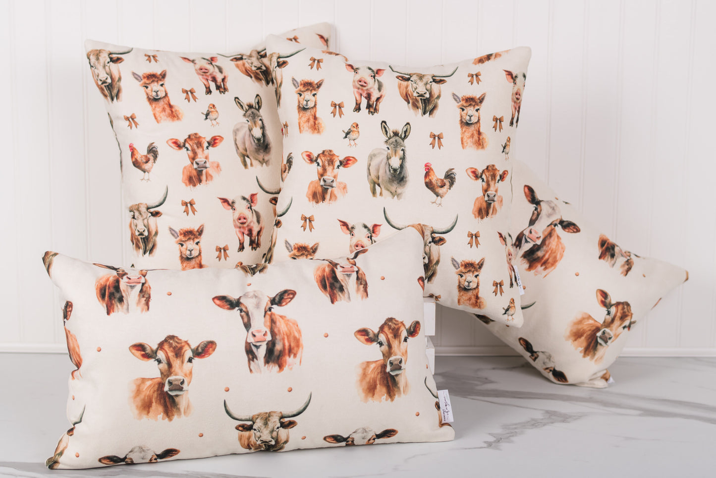 Decorative pillows with cow pattern on a light background