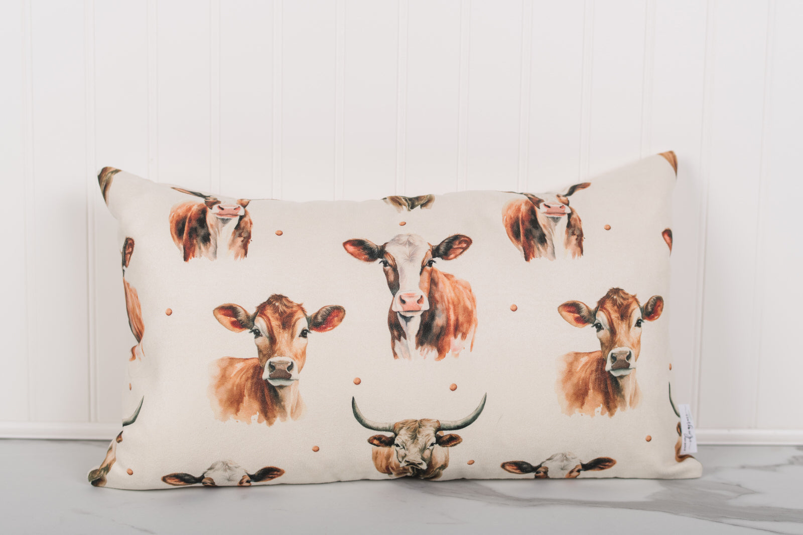 Pillow with cow pattern on a white background