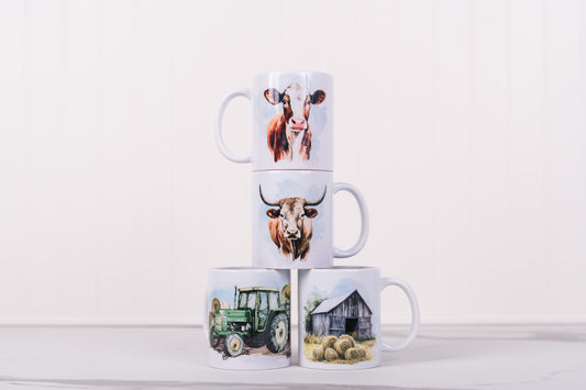 Stack of four mugs with farm-themed designs on a white background
