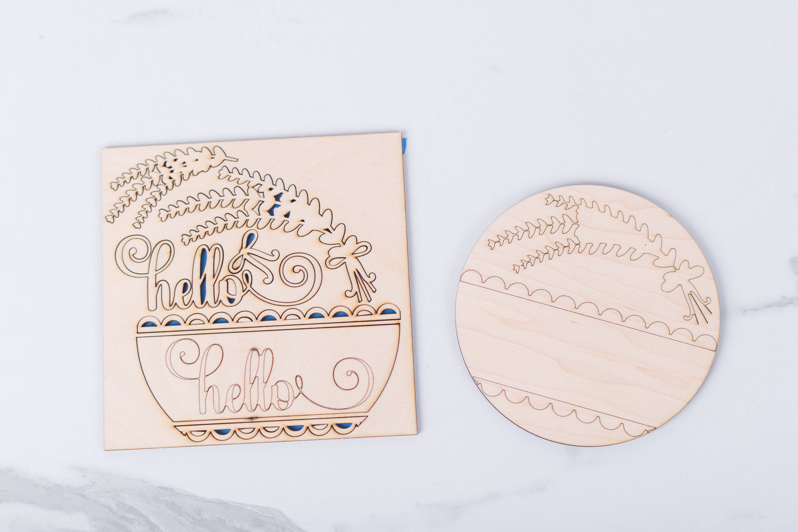 Wooden Lavender cutouts with decorative text and patterns on a light gray background