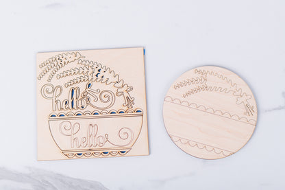 Wooden Lavender cutouts with decorative text and patterns on a light gray background