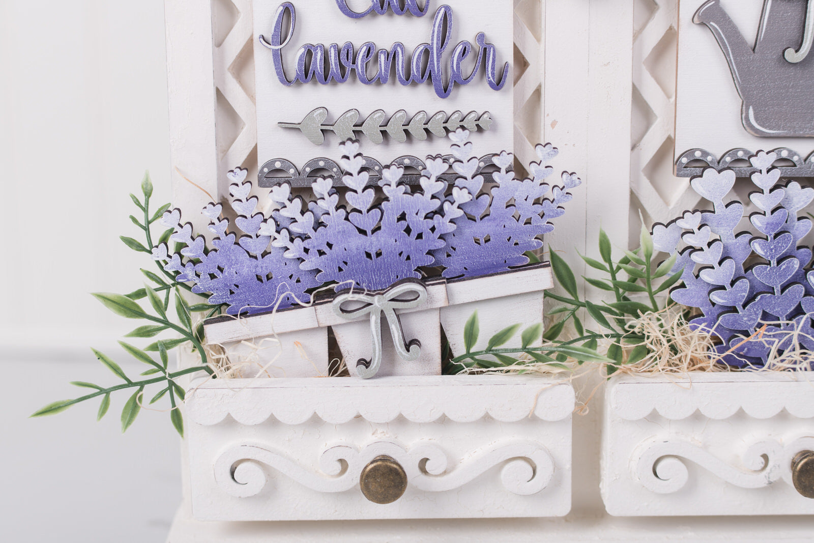 Decorative elements with 'Lavender' text and floral patterns on a white background