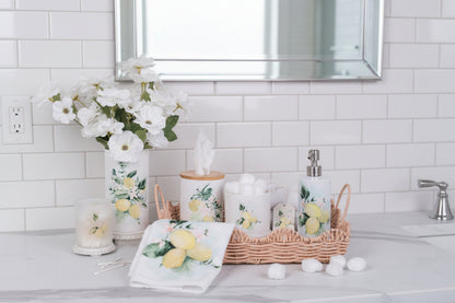 Lemon canisters styled in a bathroom on a scallop tray