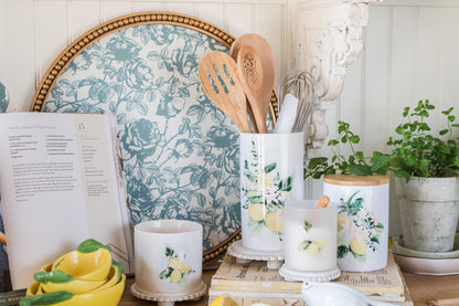 Lemon canisters, and a lemon utensil holder in a kitchen