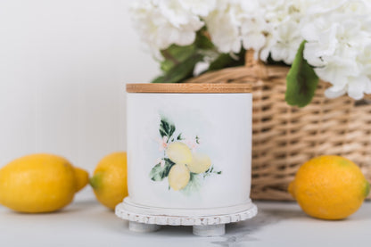 Small lemon, ceramic canister, styled with a basket of flowers and lemons
