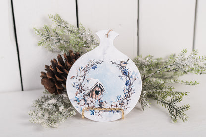 Ceramic spoon rest with snowy birdhouse and blue berry branches