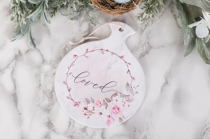 Ceramic spoon holder with soft blush florals and word loved