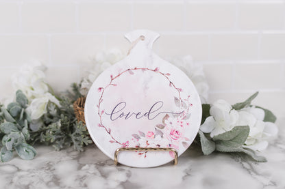 Blush floral ceramic spoon rest with “loved” in script