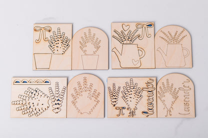 Set of wooden laser-cut lavender inserts with garden designs on a light gray background