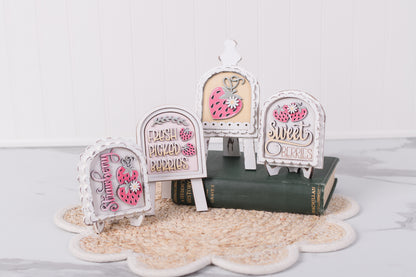 strawberry themed diy mini arch signs styled on small display stands