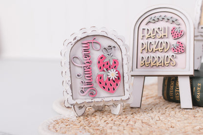 Decorative mini arch sign kits with 'Strawberry' and 'Fresh Picked Berries' text on a white background.