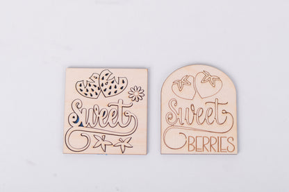 Two wooden kits with 'sweet' and 'sweet berries' text on a light gray background