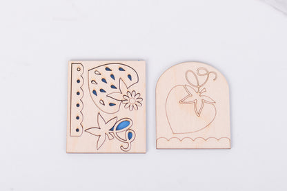 Wooden blanks with strawberries and floral designs on a white background