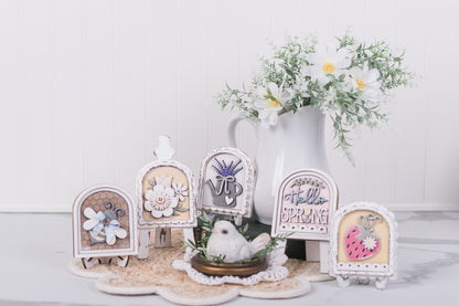 Mini interchangeable arches with a vase of flowers in the background