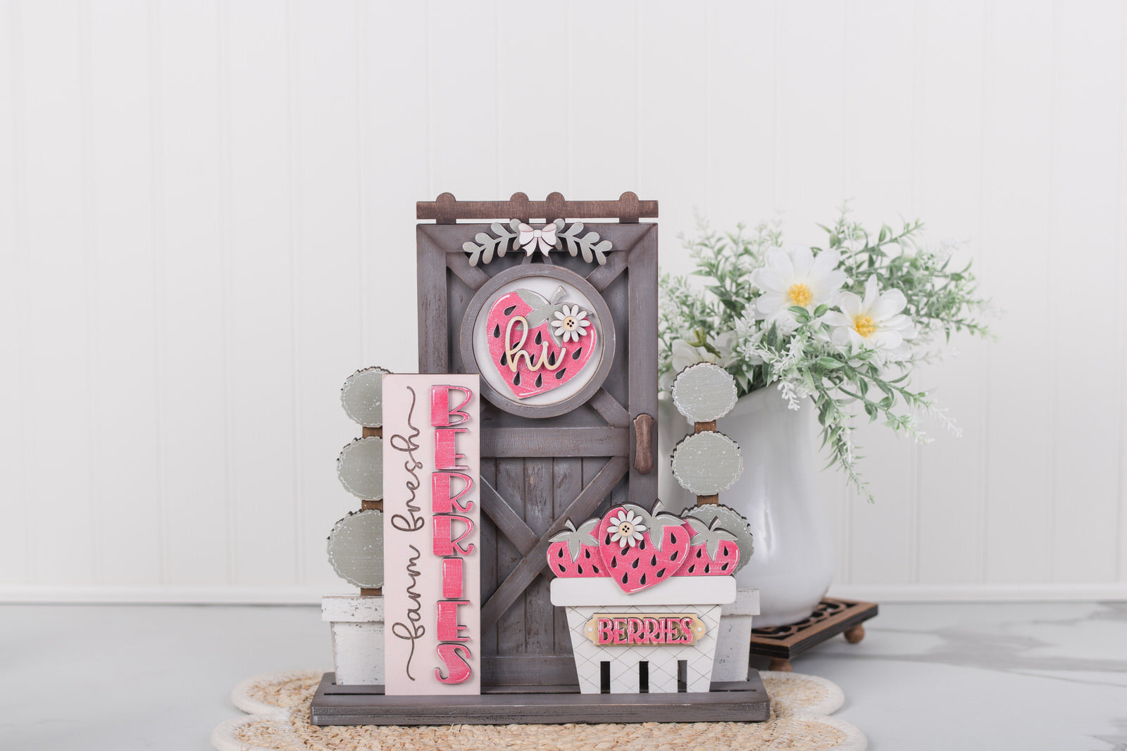 Decorative sign with 'Hi' and 'Hello' text on a wooden stand with a white background