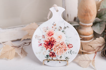 Ceramic spoon rest with hydrangeas, roses, and eucalyptus