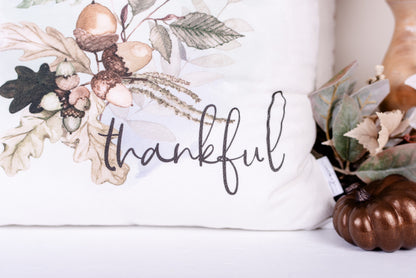 Close up of thankful script on handsewn, white velveteen Woodland pillow cover. 