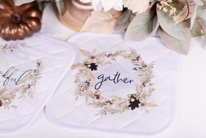 Fall potholder with the word, gather in a leaf and acorn wreath.