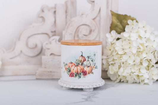 Small ceramic jar with warm pumpkins for bathroom use