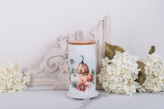 Large ceramic bathroom jar with warm pumpkin artwork and sealed bamboo lid
