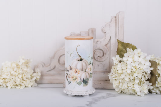 Large ceramic canister with soft white pumpkins and bamboo lid