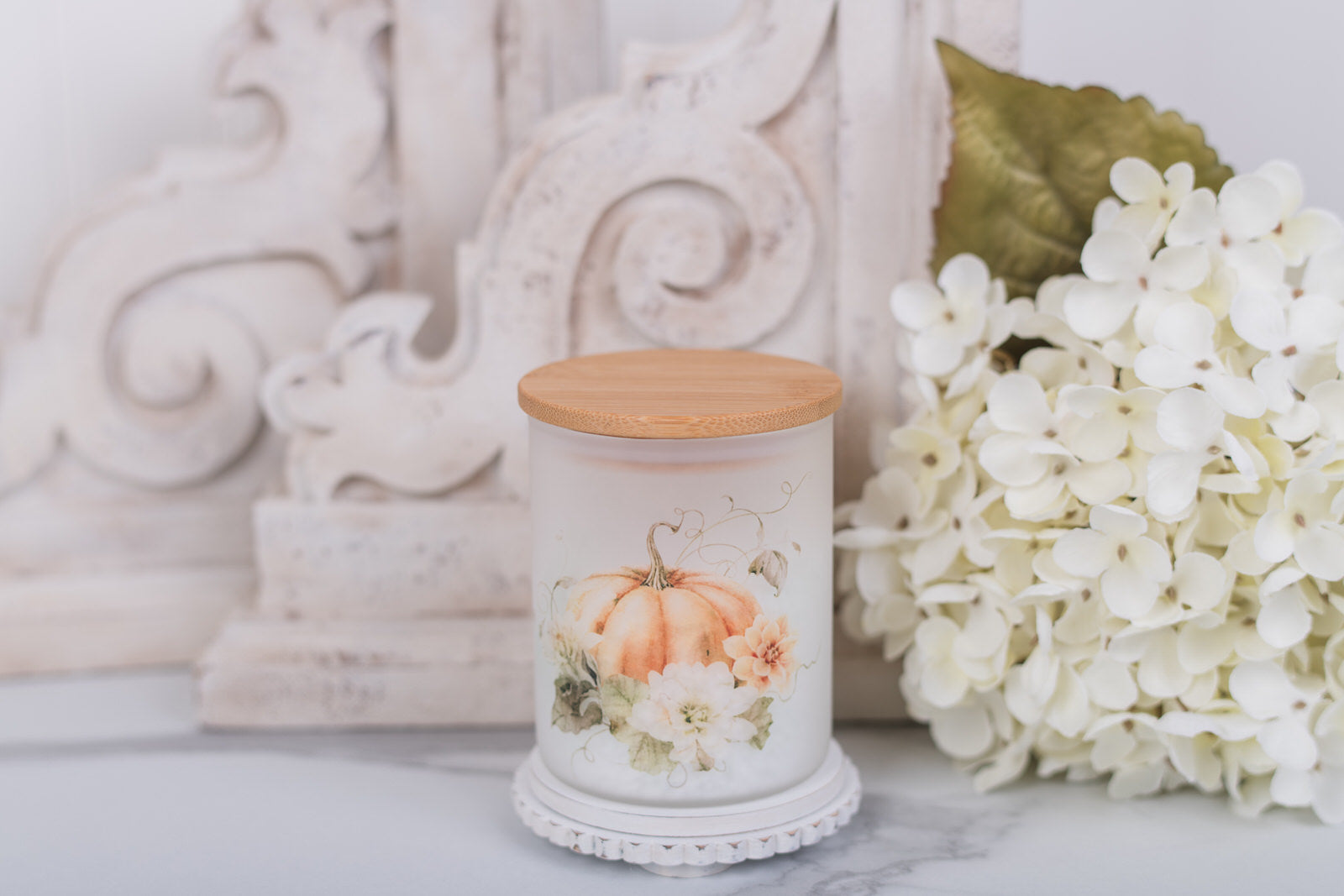 Extra small glass canister with pumpkin floral art and bamboo lid