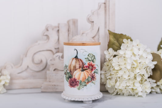 Medium ceramic canister with pumpkin floral artwork and bamboo lid