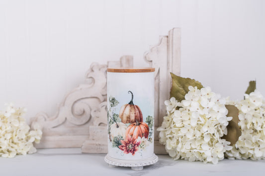 Large ceramic canister with pumpkin floral design and bamboo lid