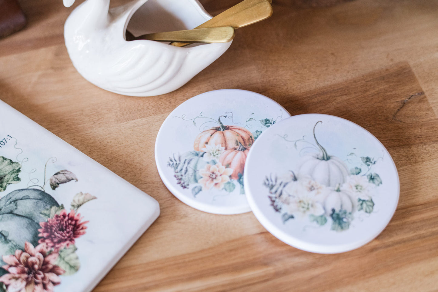 Ceramic round coasters with vintage pumpkins in soft tones