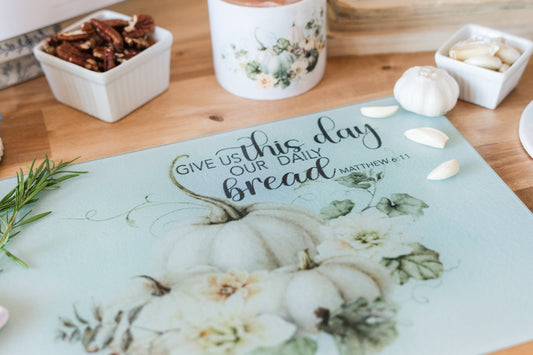 Soft pastel fall glass cutting board with Matthew 6:11 scripture