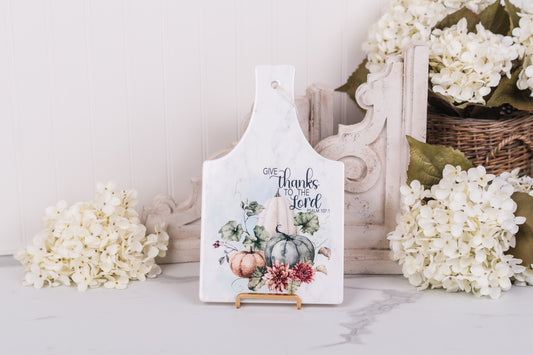 Warm fall ceramic trivet with pumpkins and “Give thanks to the Lord” scripture