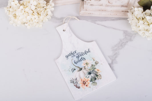 Ceramic rectangle trivet with “Gather here with grateful hearts” and soft pumpkins