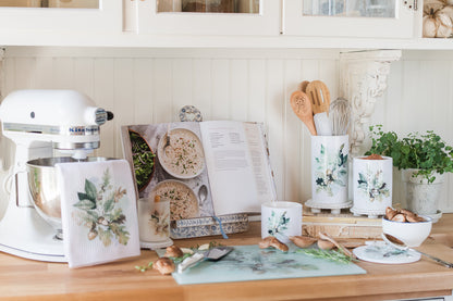 Fall kitchen counter organizer with soft watercolour leaf design on a counter with kitchen tools