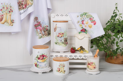 Decorative kitchen items with fresh floral designs on a white surface.