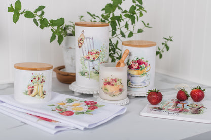 Decorative kitchen canisters with floral designs on a kitchen counter.