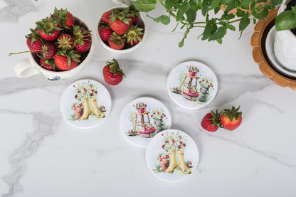 Set of four strawberry coasters with vintage summer charm.