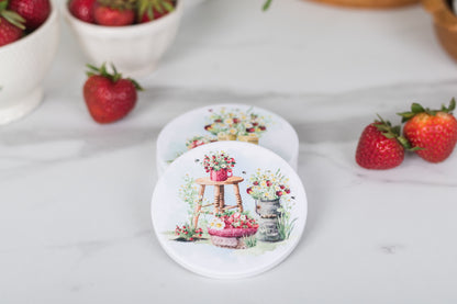 Set of four strawberry coasters with vintage summer charm.