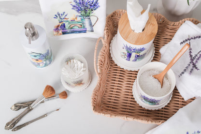 Set of ceramic canisters with watercolour lavender surrounded by bathroom items