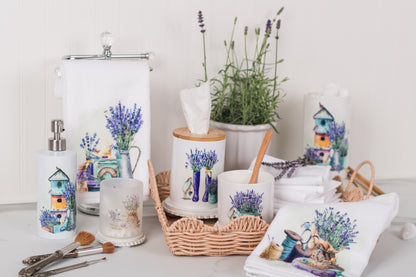 Collection of home decor items with lavender designs on a white surface.