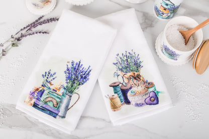 Two hand towels with floral designs on a white surface.