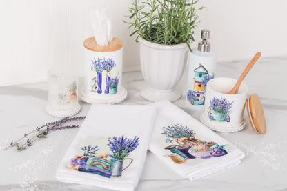Decorative towels with lavender designs on a white surface