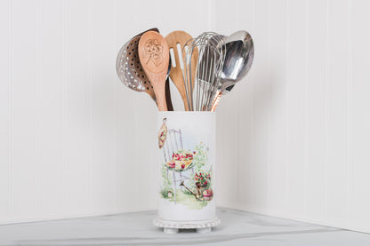 Kitchen utensil holder with utensils on a white background