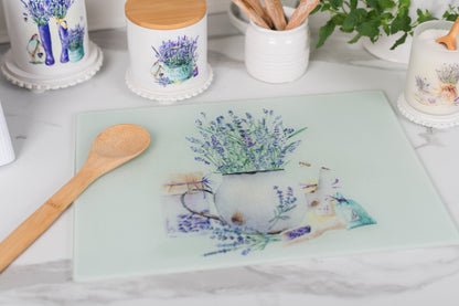Glass cutting board with floral design on a kitchen counter