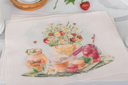 Set of four strawberry placemats on a farmhouse summer table.